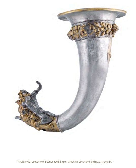 Rhyton with protome of Silenus reclining on wineskin, silver and gilding. 175-150 BC.